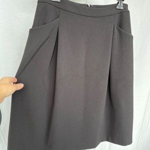 Pink Tartan (8) black gabardine midi skirt with pockets and soft front pleats.